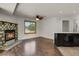 The living room boasts a cozy fireplace and wood floors for a comfortable ambiance at 5250 S Huron Way # 3-205, Littleton, CO 80120