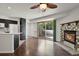 Bright living room with access to a balcony and featuring a fireplace and hardwood floors at 5250 S Huron Way # 3-205, Littleton, CO 80120