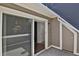 Private patio with sliding glass doors with covered area and neutral siding at 5250 S Huron Way # 3-205, Littleton, CO 80120