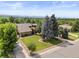 Aerial view of home with mature trees, landscaped yard, and mountain views, showcasing its prime location at 1025 S Butler Way, Lakewood, CO 80226