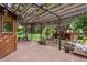 Outdoor patio with wood pergola extending to backyard with gazebo at 1025 S Butler Way, Lakewood, CO 80226