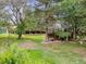 Lush backyard with a charming gazebo and ample space, creating a serene outdoor oasis for peaceful enjoyment at 1025 S Butler Way, Lakewood, CO 80226