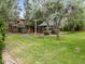 Landscaped backyard featuring a gazebo and expansive green lawn, perfect for outdoor entertaining and relaxation at 1025 S Butler Way, Lakewood, CO 80226