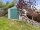Functional backyard shed providing convenient storage, complemented by trees and landscaping for added appeal at 1025 S Butler Way, Lakewood, CO 80226