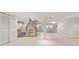 Spacious carpeted basement with stairs to upper level and kitchenette at 1025 S Butler Way, Lakewood, CO 80226