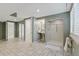 Basement bathroom features a tiled shower and access to other rooms at 1025 S Butler Way, Lakewood, CO 80226