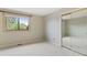 Bright bedroom with carpet, closet, and window overlooking the outside at 1025 S Butler Way, Lakewood, CO 80226