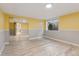 Bright basement bedroom with wood-look floors, natural light and a mirrored closet at 1025 S Butler Way, Lakewood, CO 80226