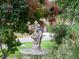 Ornamental fountain amidst landscaped greenery, enhancing the property's aesthetic charm and tranquil ambiance at 1025 S Butler Way, Lakewood, CO 80226