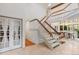 Bright foyer with staircase and view to dining room at 1025 S Butler Way, Lakewood, CO 80226