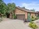 Spacious attached garage with a well-maintained driveway and verdant front yard at 1025 S Butler Way, Lakewood, CO 80226