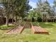 Established backyard garden beds offer the opportunity to grow your own food at 1025 S Butler Way, Lakewood, CO 80226