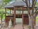 Backyard wooden gazebo with stone base and lattice details in fenced backyard at 1025 S Butler Way, Lakewood, CO 80226
