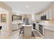Bright kitchen with an island cooktop and a view to the dining area at 1025 S Butler Way, Lakewood, CO 80226