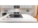 Close up of kitchen island with modern cooktop at 1025 S Butler Way, Lakewood, CO 80226