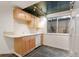 Well-lit basement kitchenette with tile floor, cabinets, dishwasher, and sink at 1025 S Butler Way, Lakewood, CO 80226