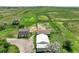 Spacious property showcasing multiple outbuildings, fenced areas, and verdant pastures at 1335 S Kio St, Watkins, CO 80137