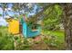 Charming backyard shed with rustic details and unique architectural style at 1335 S Kio St, Watkins, CO 80137