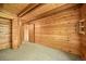 Neutral bedroom with wood paneled walls and ceiling and neutral carpet at 1335 S Kio St, Watkins, CO 80137