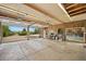 Large garage with door open features workspace, natural light, and ample storage at 1335 S Kio St, Watkins, CO 80137