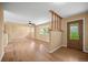 Cozy living room featuring hardwood floors, natural light, and a dining area at 1335 S Kio St, Watkins, CO 80137