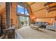 Inviting living room with a wood-burning stove, large windows, and access to an outdoor balcony at 1335 S Kio St, Watkins, CO 80137