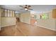 Open-concept living room with hardwood floors and an open view to the kitchen at 1335 S Kio St, Watkins, CO 80137