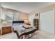Comfortable bedroom with plush carpeting and ample closet space at 7893 Allison Way # 101, Arvada, CO 80005