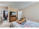 Cozy bedroom with neutral walls and carpet, adjacent to the bathroom at 7893 Allison Way # 101, Arvada, CO 80005