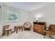 Well-lit bedroom features neutral walls, plush carpeting, and a serene atmosphere ideal for relaxation and rest at 7893 Allison Way # 101, Arvada, CO 80005