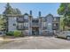 Well-maintained condo complex featuring manicured landscaping, ample parking, and a welcoming entrance at 7893 Allison Way # 101, Arvada, CO 80005