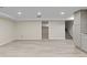 Spacious basement with light wood flooring and neutral paint provides a versatile living space at 2230 Jamaica St, Aurora, CO 80010