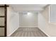 Finished basement featuring gray carpet, neutral paint, and window at 2230 Jamaica St, Aurora, CO 80010