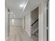 Finished basement featuring a long open space, recessed lights, and carpeted stairs at 2230 Jamaica St, Aurora, CO 80010