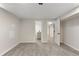 Finished basement area featuring neutral paint, gray carpet, and two doorway entries at 2230 Jamaica St, Aurora, CO 80010