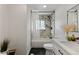 Bright bathroom with a shower-tub combination and modern vanity at 2230 Jamaica St, Aurora, CO 80010