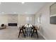 Dining area with fireplace, plenty of room for seating, and great light at 2230 Jamaica St, Aurora, CO 80010