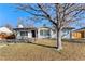 Well-kept single-Gathering home with a brick facade, mature trees, and a manicured front lawn at 2230 Jamaica St, Aurora, CO 80010