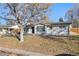 Attractive single-story home with a brick exterior, neat landscaping, and a welcoming front entrance at 2230 Jamaica St, Aurora, CO 80010