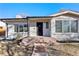 Charming brick home with a well-maintained front yard, inviting entrance, and large windows at 2230 Jamaica St, Aurora, CO 80010