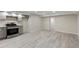 Basement kitchen with stainless steel appliances and light gray cabinets at 2230 Jamaica St, Aurora, CO 80010