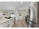 Bright, modern kitchen features stainless steel appliances and white cabinets at 2230 Jamaica St, Aurora, CO 80010