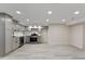 Spacious basement kitchen with gray cabinets and stainless steel appliances at 2230 Jamaica St, Aurora, CO 80010