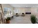 Bright living room with stone fireplace, ample windows, and modern decor at 2230 Jamaica St, Aurora, CO 80010