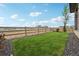 Well-maintained backyard with a wooden fence and a view of the surrounding neighborhood at 8360 Snake River St, Littleton, CO 80125