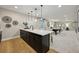 Spacious kitchen with a large island, bar seating, and an open view to the living area at 8360 Snake River St, Littleton, CO 80125