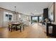Open-concept living and dining area with ample natural light and stylish furnishings at 8360 Snake River St, Littleton, CO 80125