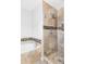 Contemporary bathroom featuring a bathtub and tiled walk-in shower at 9124 E 29Th Pl, Denver, CO 80238