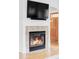 Close-up of the fireplace, showcasing the tile surround and mantel detail at 9124 E 29Th Pl, Denver, CO 80238