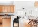 Open-concept kitchen featuring cabinets, countertop seating, and view to the living room at 9124 E 29Th Pl, Denver, CO 80238
